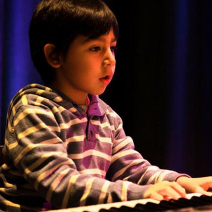 Our piano lessons are great. Look our student on stage!