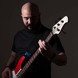 Bass guitar instructor, Isidro. He covers music lessons for kids, teens and adults.
